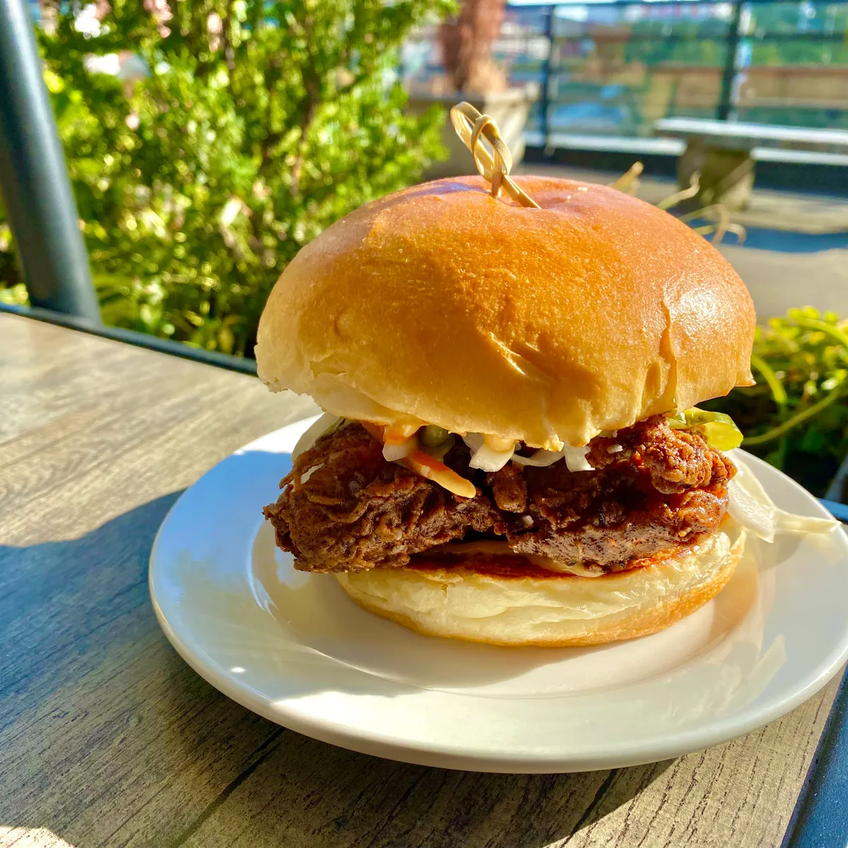 fried chicken sandwich on a white plate